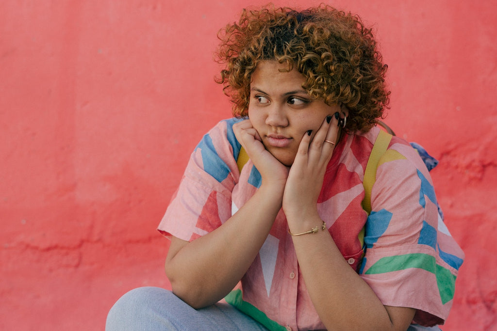 person wearing shirt with bright print